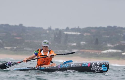 Kira Bester racing her surfski