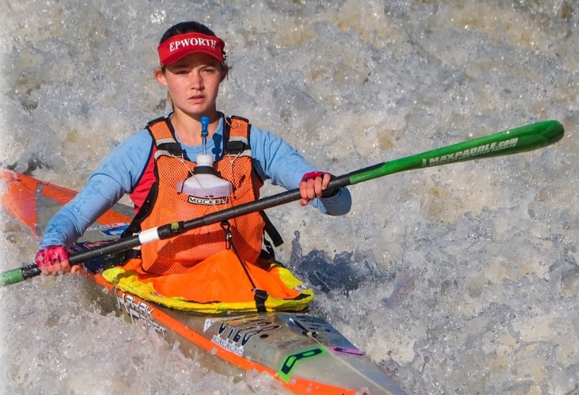 A K1 paddler in whitewater on the Fish River, from the 2026 race poster